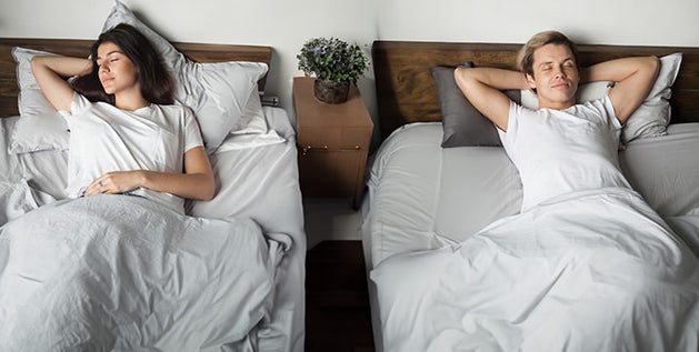 A couple practicing sleep divorce