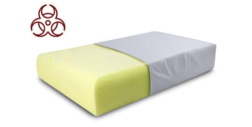 Yellow memory foam block with biohazard symbol overlay illustrating concerns about whether memory foam is toxic.