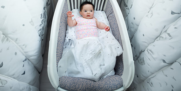 baby in a crib mattress